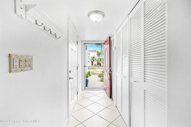 corridor featuring light tile patterned flooring