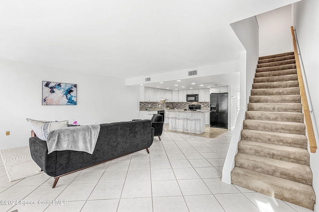 living room featuring light tile patterned floors