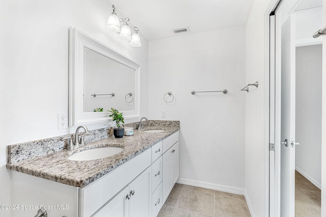 bathroom featuring tile patterned floors and vanity