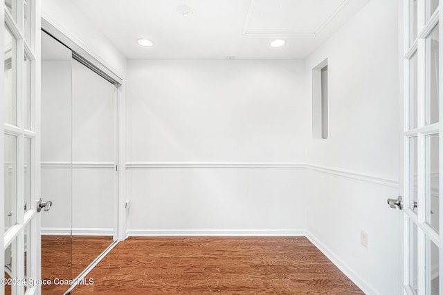 spacious closet with hardwood / wood-style floors