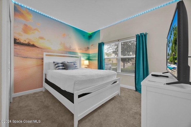 bedroom featuring light carpet