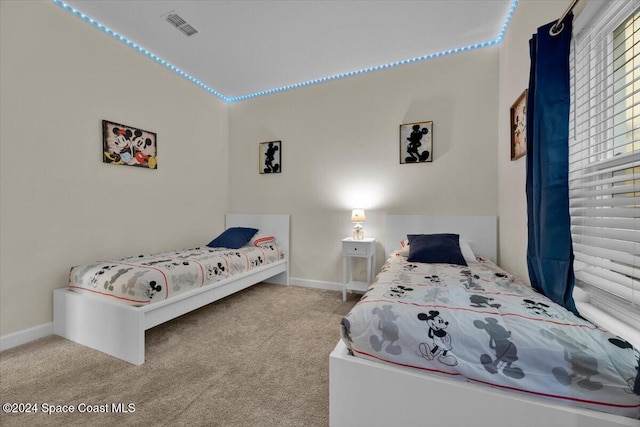 bedroom featuring light colored carpet