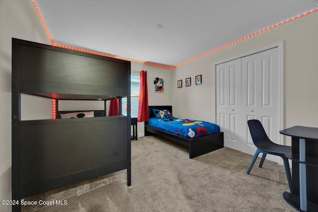 carpeted bedroom with a closet