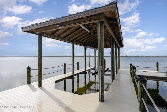 dock area with a water view