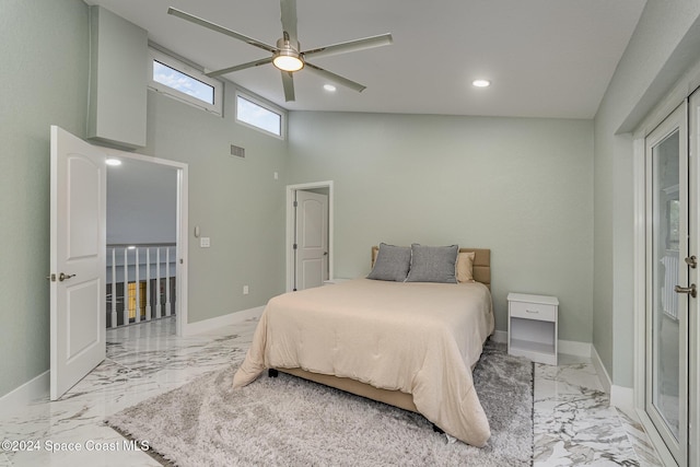 bedroom featuring ceiling fan and a towering ceiling