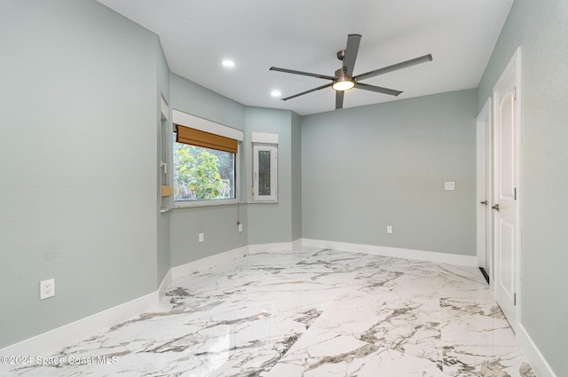 unfurnished bedroom featuring ceiling fan