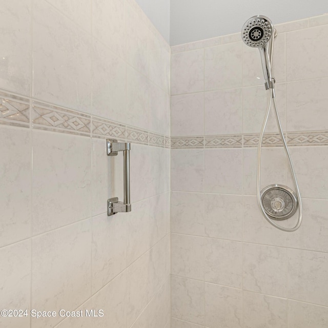 bathroom with tiled shower