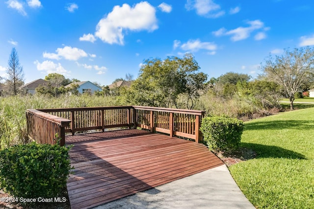 wooden terrace with a yard