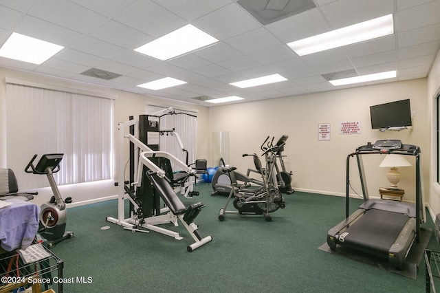 exercise room with a drop ceiling