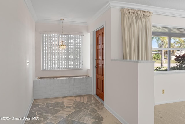 interior space with ornamental molding and an inviting chandelier