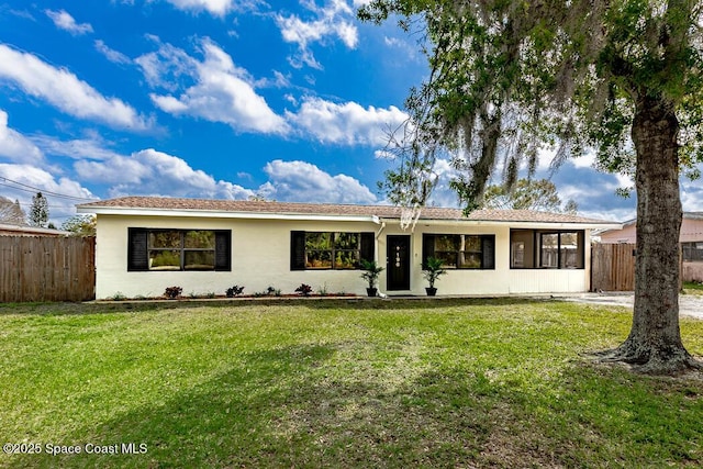 ranch-style home with a front yard