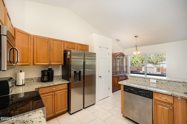 kitchen featuring pendant lighting, light stone counters, stainless steel appliances, and vaulted ceiling