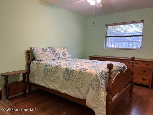 bedroom featuring ceiling fan and dark hardwood / wood-style flooring