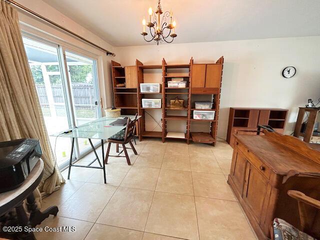 office area with a notable chandelier and light tile patterned floors