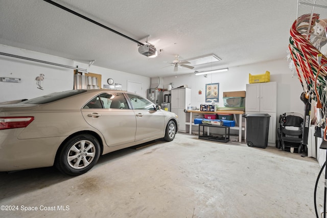 garage featuring ceiling fan and a garage door opener