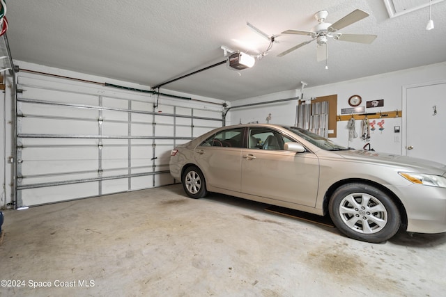 garage featuring ceiling fan and a garage door opener