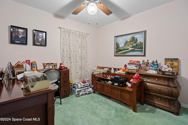 office space with ceiling fan and light colored carpet