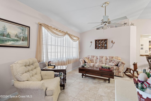 tiled living room featuring ceiling fan and vaulted ceiling