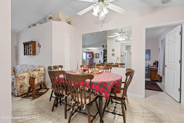 tiled dining room with vaulted ceiling