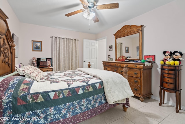 tiled bedroom with ceiling fan