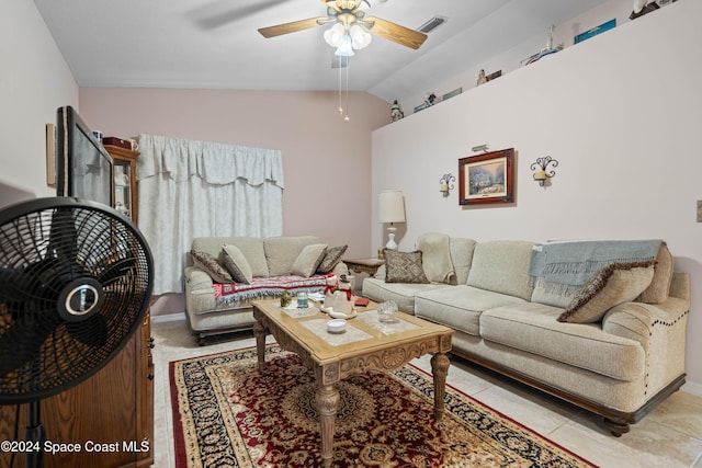 tiled living room with ceiling fan and lofted ceiling