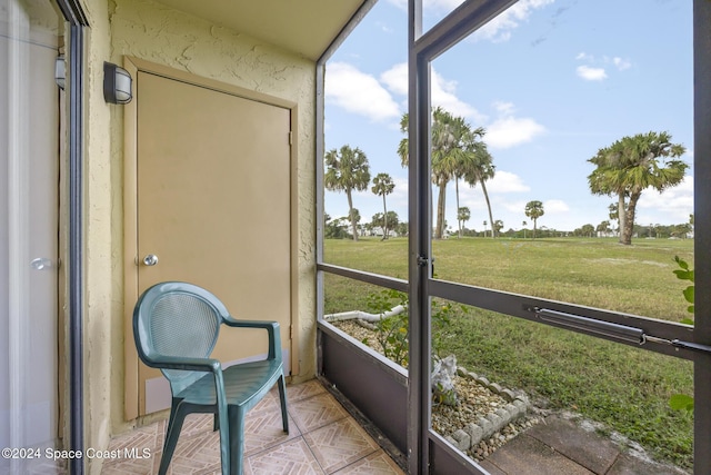 sunroom / solarium with a rural view