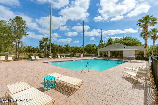 view of pool featuring a patio