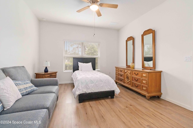 bedroom with light hardwood / wood-style flooring and ceiling fan