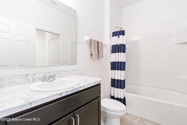 full bathroom featuring shower / tub combo, vanity, and toilet