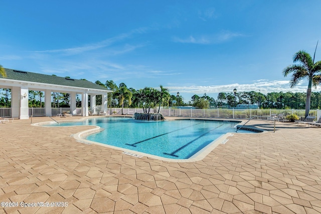 view of swimming pool with a patio