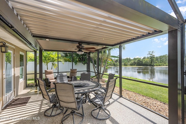 sunroom with plenty of natural light and a water view