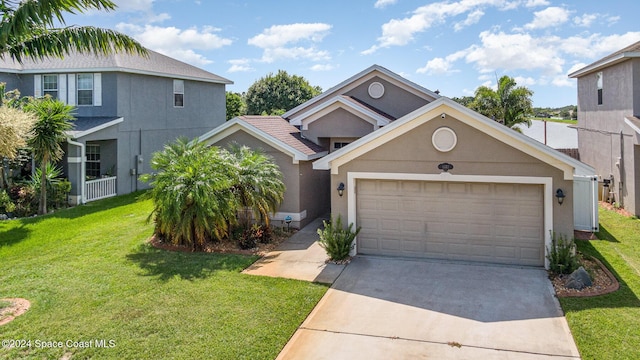 view of front property with a garage and a front lawn