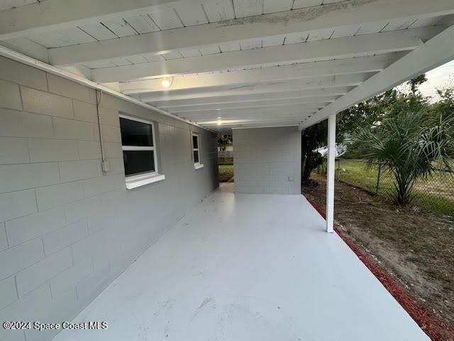 view of patio featuring a carport