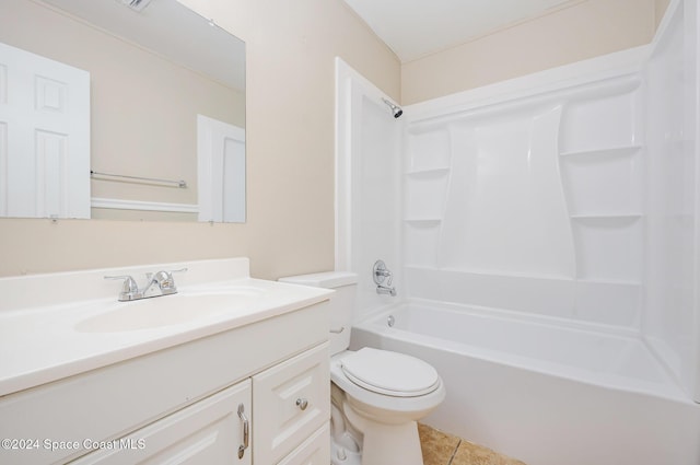 full bathroom featuring tile patterned floors, washtub / shower combination, vanity, and toilet