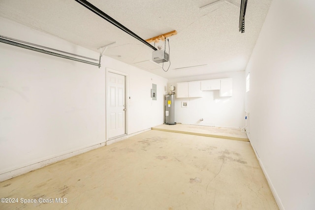 garage featuring electric panel, a garage door opener, and water heater