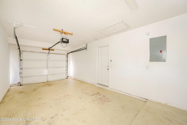 garage featuring electric panel and a garage door opener