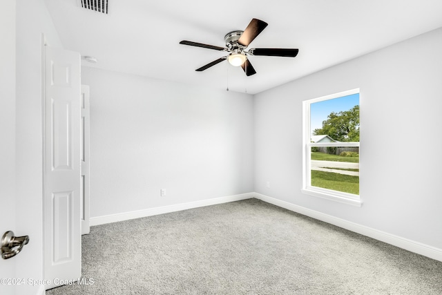 empty room with carpet and ceiling fan