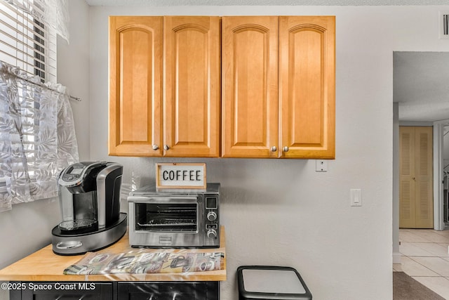 kitchen featuring light tile patterned flooring