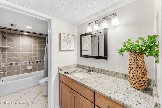 full bathroom featuring vanity, shower / bath combo, tile patterned flooring, toilet, and a textured ceiling