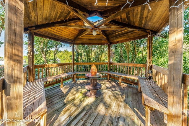 deck with a gazebo and ceiling fan