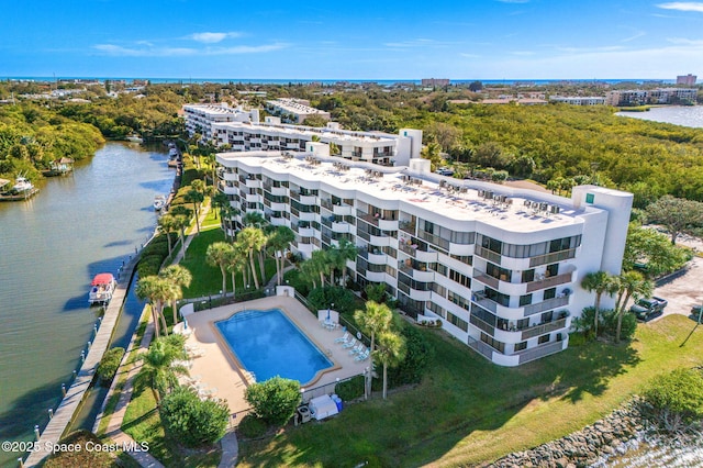 birds eye view of property with a water view