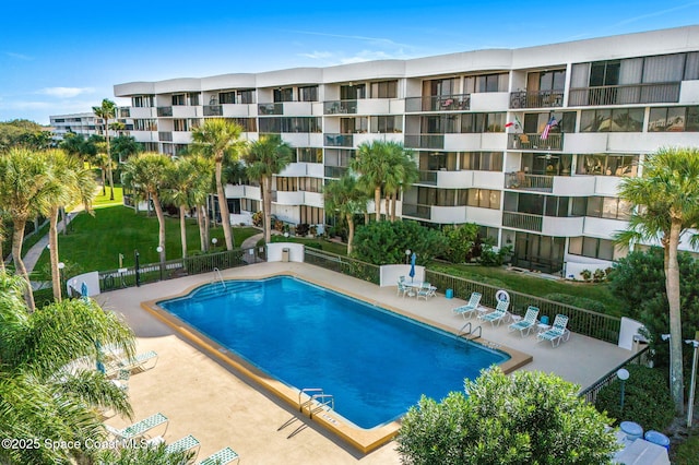 view of swimming pool featuring a patio area