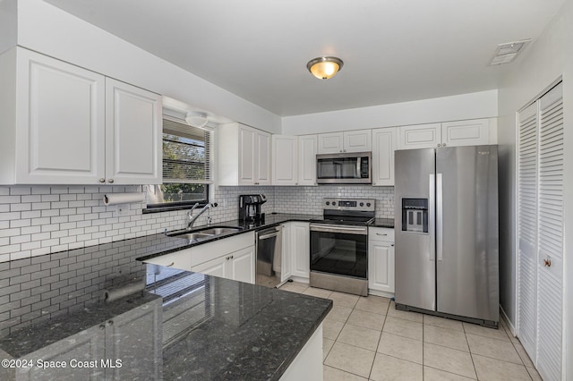 kitchen with sink, white cabinets, and appliances with stainless steel finishes