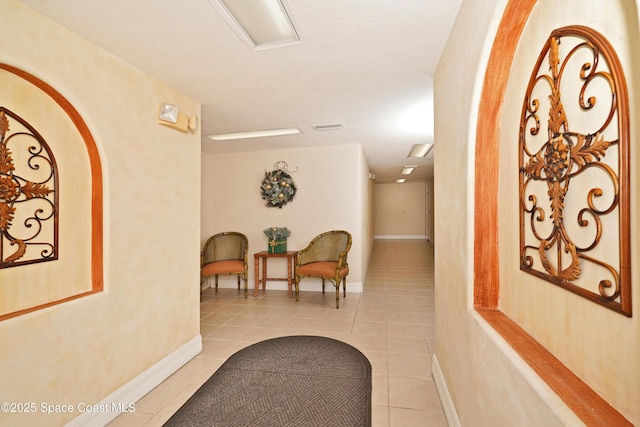 hallway featuring light tile patterned flooring