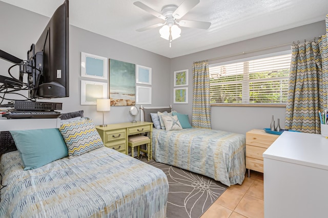 tiled bedroom with ceiling fan