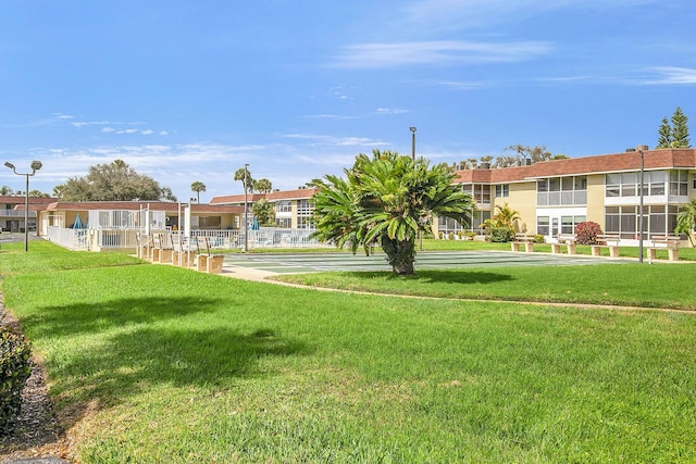 view of home's community with a lawn