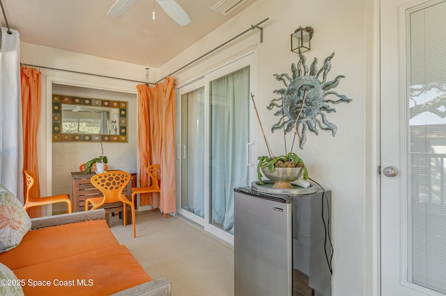 living area with ceiling fan