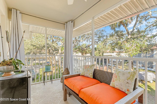 sunroom / solarium with ceiling fan