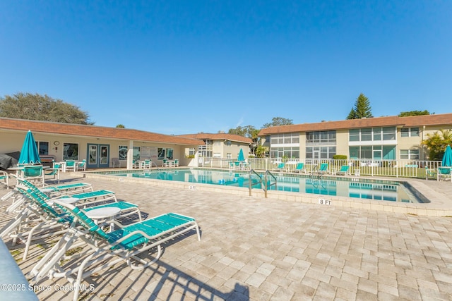 view of swimming pool with a patio area