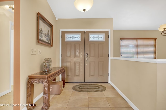 entryway with light tile patterned floors